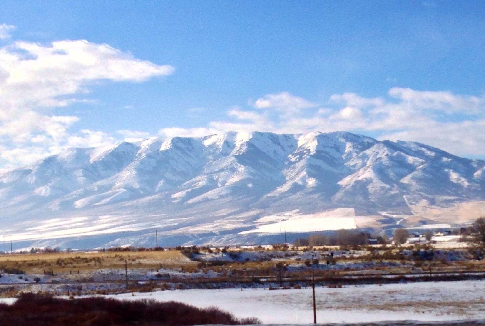 Snow-covered mountains under blue sky
